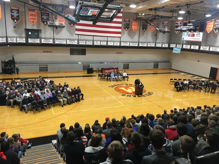 image of a gym filled with people in chairs